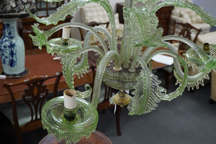 An ornate leaf and floral green glass Murano three branch chandelier, 84cm high.